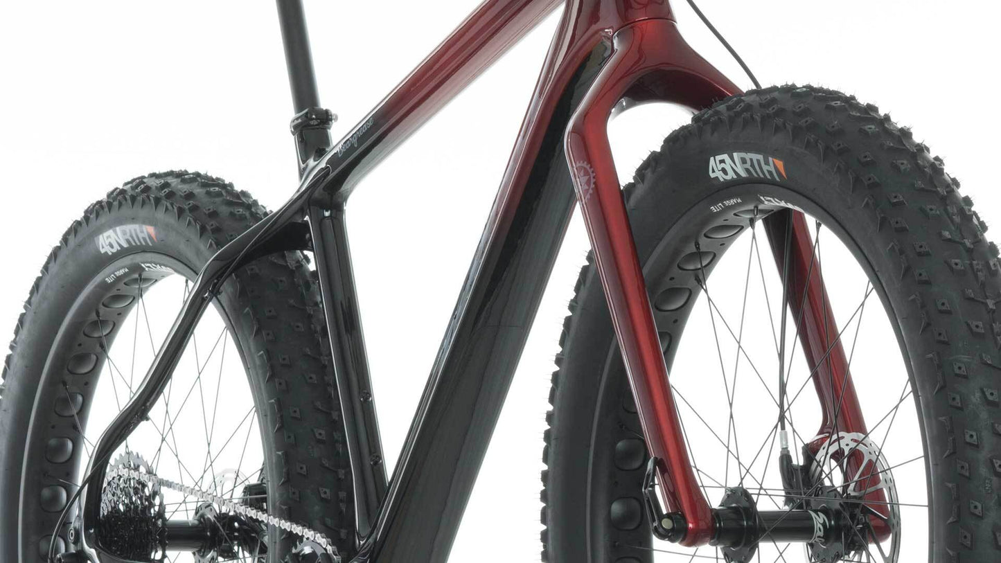 Salsa Beargrease Carbon Frameset built as bike three-quarter front view black to maroon fade