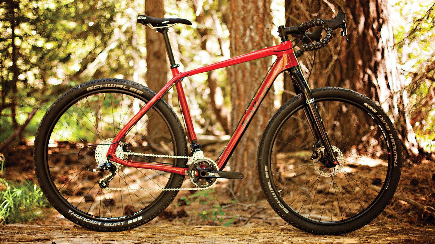 Salsa Cutthroat Carbon Rival 22 bike red color side view outside in woods