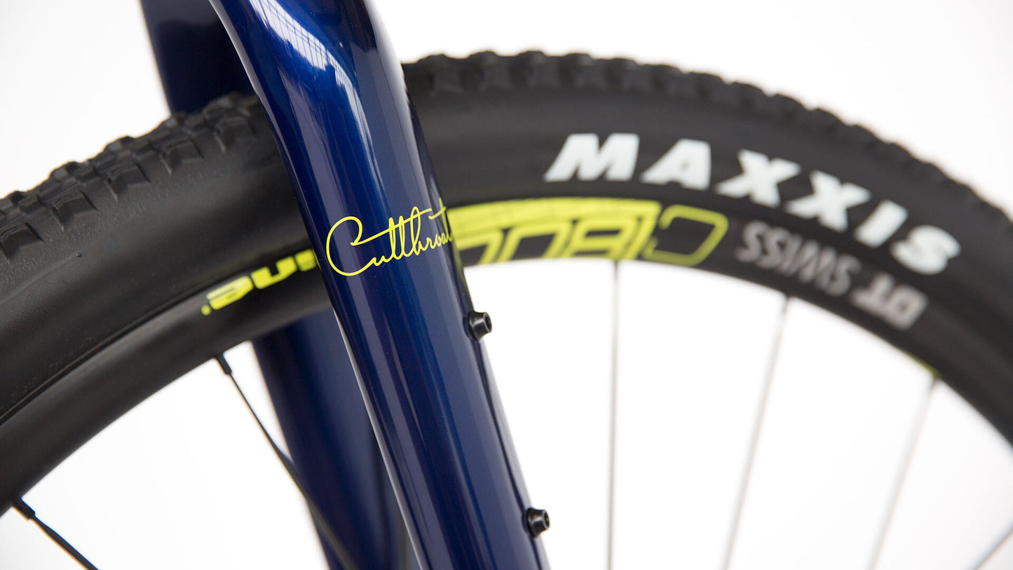 Salsa Cutthroat Carbon bike blue and yellow color fork and front wheel area focus