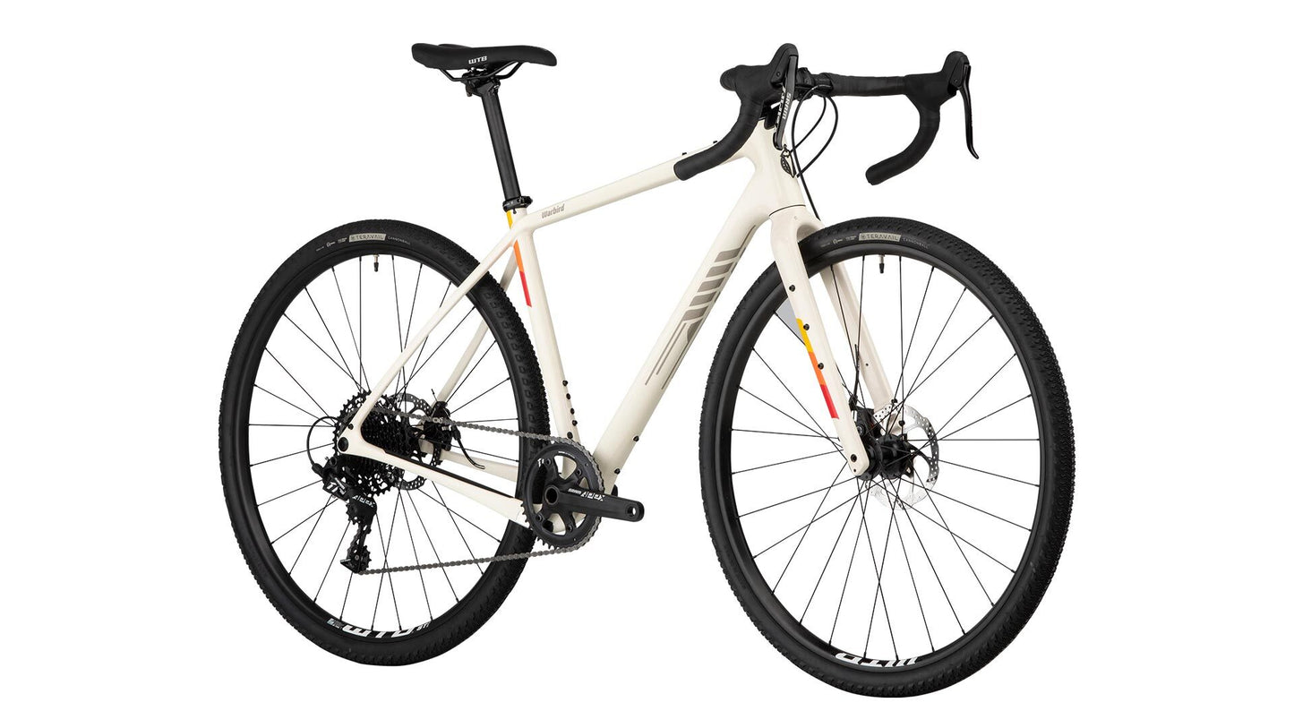 Warbird Carbon Apex 1 bike tan color front three-quarter view