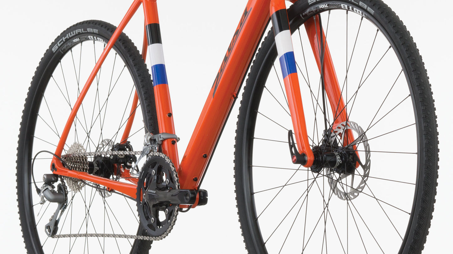 Salsa Warbird Tiagra bike orange color front three-quarter view lower part of bike focus