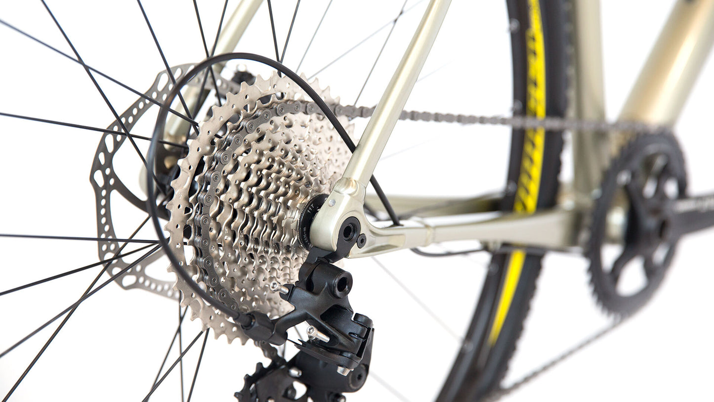 Close-up of a bicycle's gear system on a white background