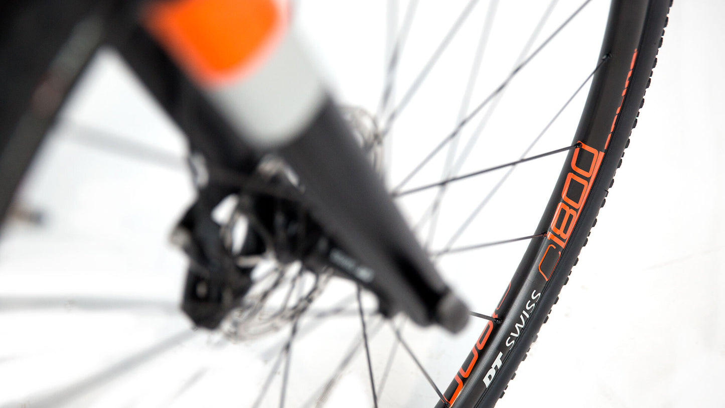 Close-up of a bicycle wheel with a blurred background