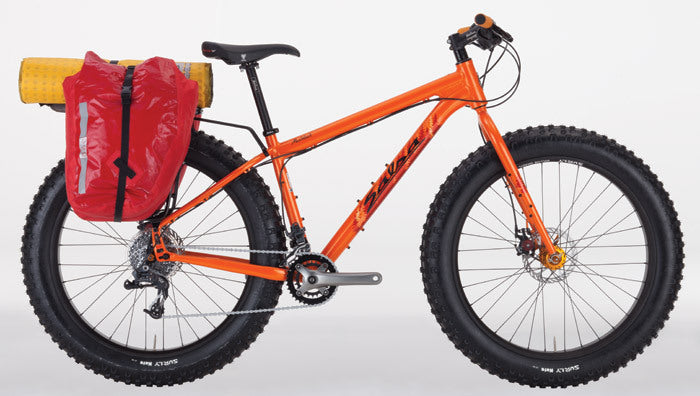 Salsa Mukluk 3 bike orange color side view showing rear rack fit with gear