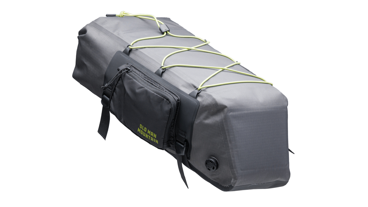 Gray Old Man Mountain Atlas Rack Pack with black straps and 'Old Man Mountain' branding - front three quarter view