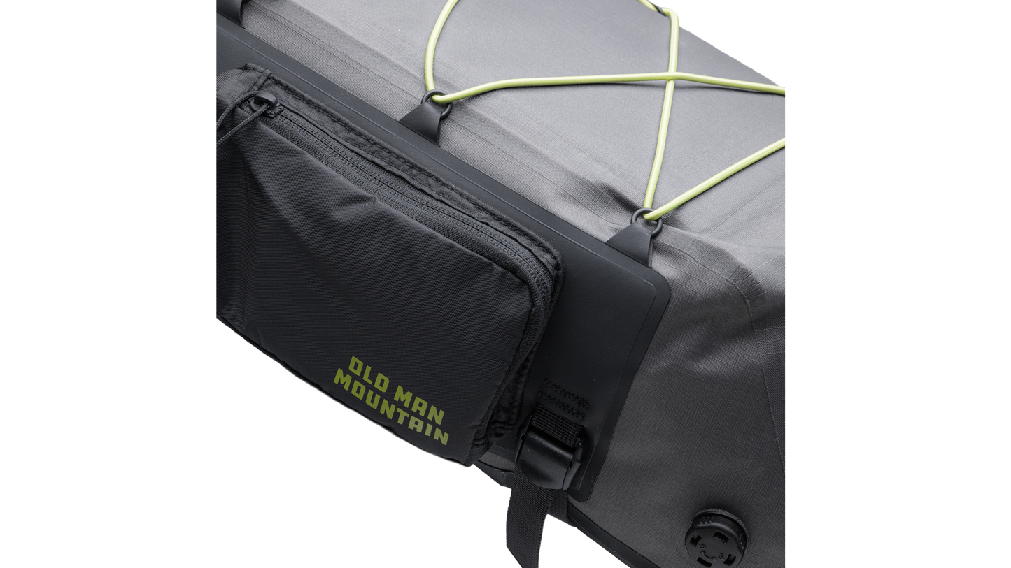 Closeup of zipper pouch on bag with 'Old Man Mountain' branding