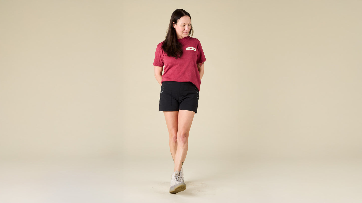 Female model faces the front while wearing the Salsa red logo tee