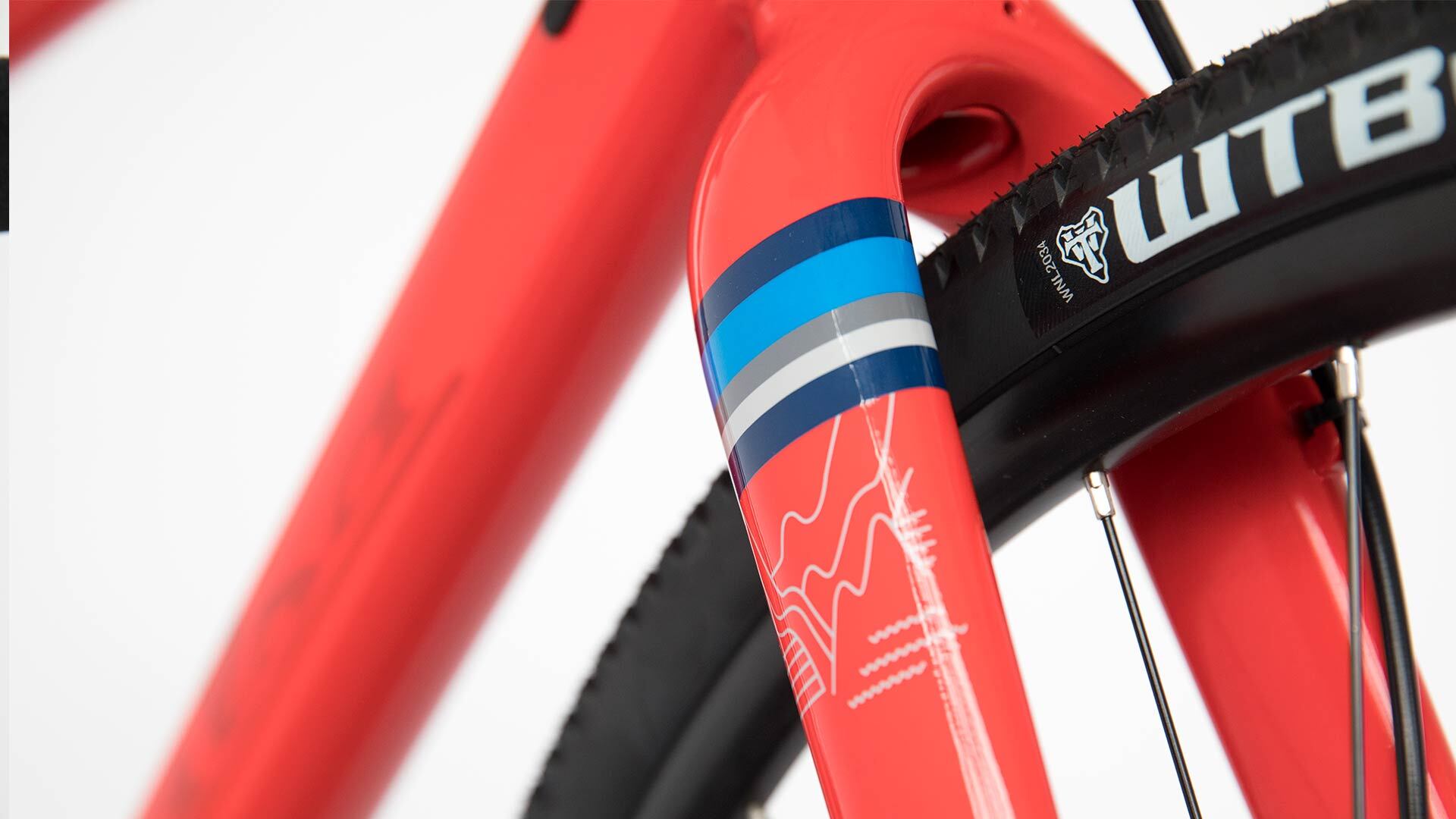 Salsa Journeyman 700c Claris bike orange color fork and front tire close-up