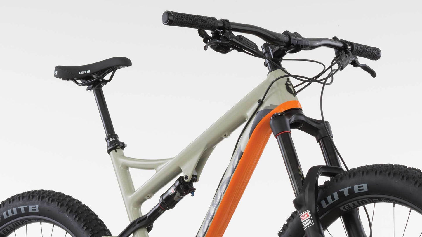 Salsa Pony Rustler Carbon bike tan color front three-quarter view top of bike focus