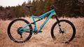 Salsa Redpoint Carbon GX1 bike blue color side view outdoors in grass
