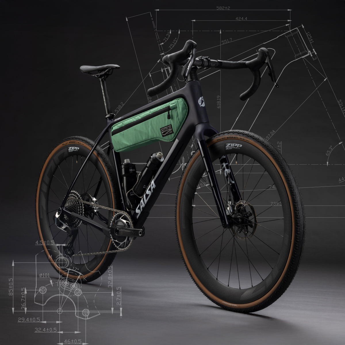 Black Salsa Flyway gravel bike with green frame bag on a dark background with technical drawings and diagrams