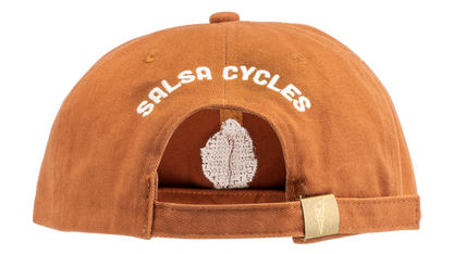 A rust-orange cotton flat-brim cap featuring 'Salsa Cycles' on the back