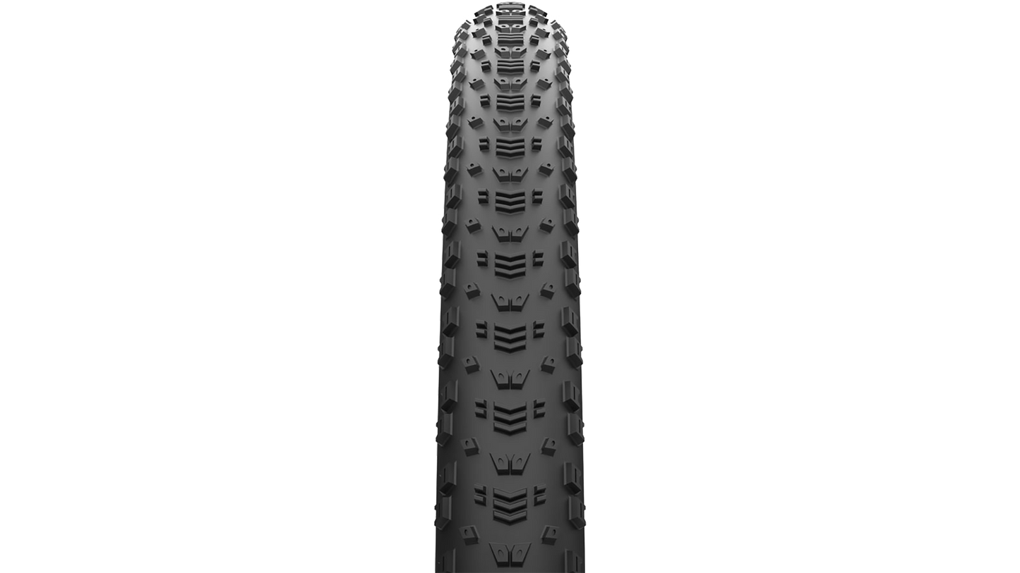 A single black mountain bike tire shown upright against a plain white background.