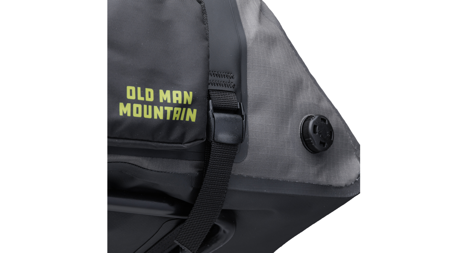 Gray Old Man Mountain Atlas Rack Pack with black straps and 'Old Man Mountain' branding - closeup of vent