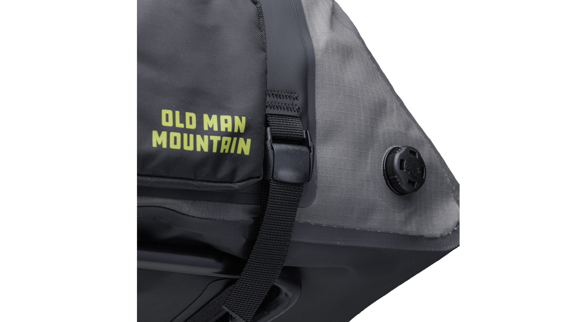 Gray Old Man Mountain Atlas Rack Pack with black straps and 'Old Man Mountain' branding - closeup of vent