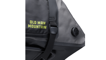 Gray Old Man Mountain Atlas Rack Pack with black straps and 'Old Man Mountain' branding - closeup of vent