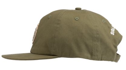 An olive green flat-brim baseball cap featuring a circular embroidered patch on the front with a pepper - side view