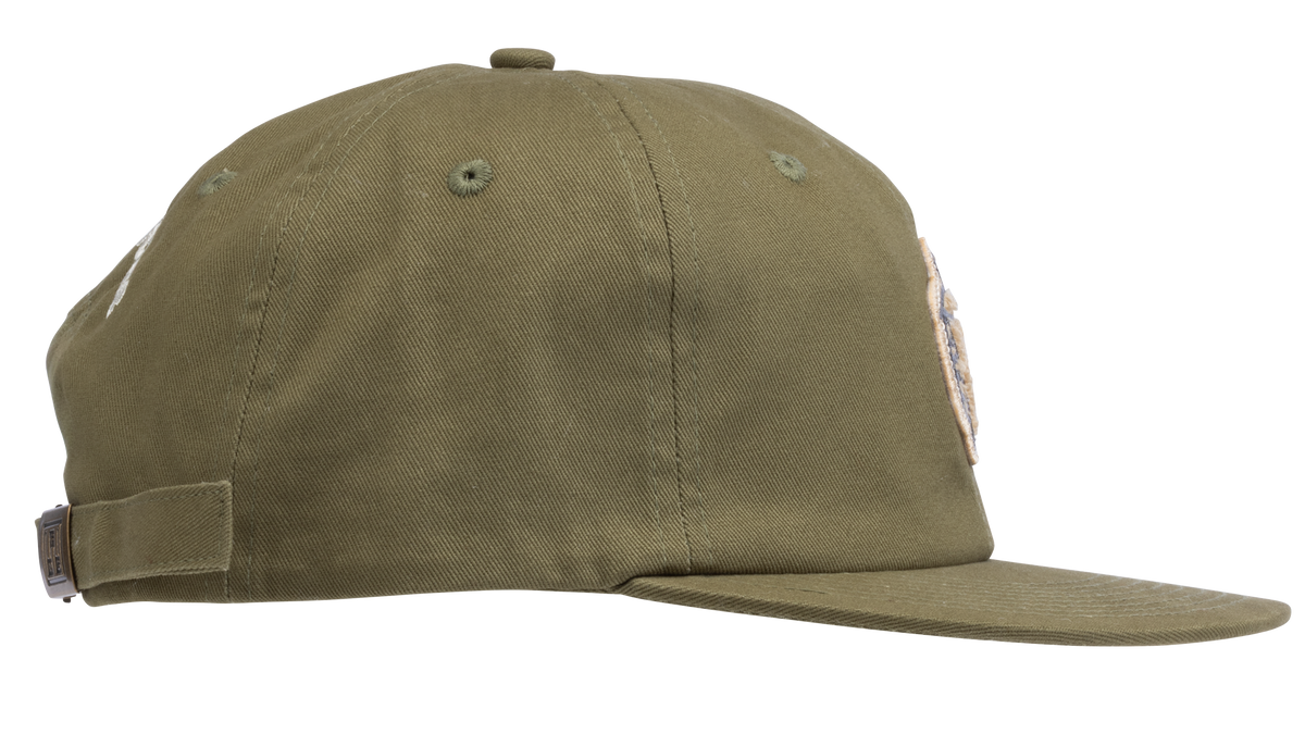 An olive green flat-brim baseball cap featuring a circular embroidered patch on the front with a pepper - side view