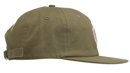 An olive green flat-brim baseball cap featuring a circular embroidered patch on the front with a pepper - side view