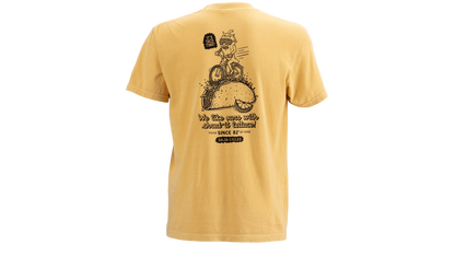 A yellow short-sleeve t-shirt shown from the back, featuring a large black graphic of a cartoon pepper riding a taco and the text 'We like ours with shred-it lettuce'.