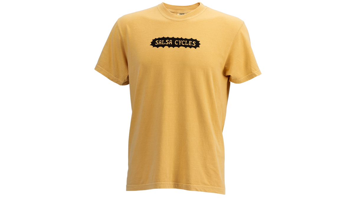 A yellow short-sleeve crewneck t-shirt with a black graphic on the chest that reads 'SALSA CYCLES' inside a jagged banner shape, shown against a plain white background.