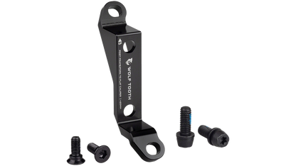 A black metal disc brake adapter with two bolts and two nuts, shown on a plain white background.